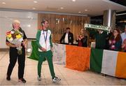 13 August 2018; Thomas Barr makes his way into the arrivals hall with his coach Hayley Harrison at the Homecoming of the Irish Team from the European Athletics Championships in Berlin at Terminal 1 in Dublin Airport. Photo by Eóin Noonan/Sportsfile