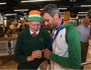13 August 2018; Thomas Barr shows his medal to Irish athletics supporter Harry Gorman at the Homecoming of the Irish Team from the European Athletics Championships in Berlin at Terminal 1 in Dublin Airport. Photo by Eóin Noonan/Sportsfile