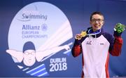 13 August 2018; Scott Quinn of Great Britain celebrates with his gold medal after winning the Men's 100m Breaststroke SB14 Final event during day one of the World Para Swimming Allianz European Championships at the Sport Ireland National Aquatic Centre in Blanchardstown, Dublin. Photo by Stephen McCarthy/Sportsfile