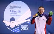 13 August 2018; Scott Quinn of Great Britain celebrates with his gold medal after winning the Men's 100m Breaststroke SB14 Final event during day one of the World Para Swimming Allianz European Championships at the Sport Ireland National Aquatic Centre in Blanchardstown, Dublin. Photo by Stephen McCarthy/Sportsfile