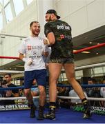 15 August 2018; Isaac Lowe, left, and  Tyson Fury during the public workouts at the Castlecourt Shopping Centre in Belfast. Photo by Ramsey Cardy/Sportsfile