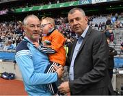 11 August 2018; GAA legend and former Dublin goalkeeper John O'Leary walks onto the pitch with his son Tom, age 7, who presented the ball to the referee, on behalf of the Jack & Jill Children's Foundation at Croke Park in Dublin. Tom, who has a very rare condition, has been supported by Jack & Jill home nursing care and John is a board member and ambassador for the charity. Here John is in conversation with John Costello, Chief Executive, Dublin County Board.  Photo by Ray McManus/Sportsfile