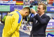 15 August 2018; Andrew Parsons, President of the International Paralympic Committee, presents the silver medal to Iaroslav Denysenko of Ukraine after placing second in the Men's 50m Freestyle S12 final during day three of the World Para Swimming Allianz European Championships at the Sport Ireland National Aquatic Centre in Blanchardstown, Dublin.  Photo by Seb Daly/Sportsfile
