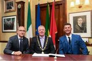 16 August 2018; Republic of Ireland manager Martin O'Neill and Republic of Ireland Women's National Team manager Colin Bell signs the visitors book in the company of Cllr. Mick Finn, Lord Mayor of Cork, at a reception hosted by the Lord Mayor of Cork for a FAI Delegation at City Hall in Cork. Photo by Stephen McCarthy/Sportsfile
