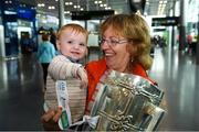 17 August 2018; Angela McKeon, with her grandaughter Stella Woods, age 10 months, from Longford, with the Liam MacCarthy Cup at the GAA Fáilte Abhaile event at Dublin Airport in Dublin. Photo by Piaras Ó Mídheach/Sportsfile