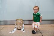 17 August 2018; Erin Peover, 18 months old, living in London, with her family from Oola, Co Limerick, with the Liam MacCarthy Cup at the GAA Fáilte Abhaile event at Dublin Airport in Dublin. Photo by Piaras Ó Mídheach/Sportsfile