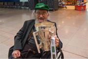 17 August 2018; John Hunt, age 98, originally from Athea, Co Limerick, and now living in Chicago, and home for the match, with the Liam MacCarthy Cup at the GAA Fáilte Abhaile event at Dublin Airport in Dublin. Photo by Piaras Ó Mídheach/Sportsfile