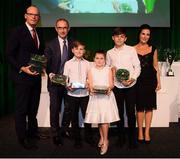 17 August 2018; The family of the late Liam Miller, wife Clare, sons Kory and Leo and daughter Belle, are presented with his Republic of Ireland international caps by An Tánaiste Simon Coveney TD and Republic of Ireland manager Martin O'Neill at the FAI Delegates Dinner & FAI Communications Awards at the Rochestown Park Hotel in Cork. Photo by Stephen McCarthy/Sportsfile
