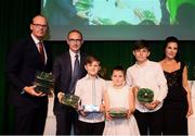 17 August 2018; The family of the late Liam Miller, wife Clare, sons Kory and Leo and daughter Belle, are presented with his Republic of Ireland international caps by An Tánaiste Simon Coveney TD and Republic of Ireland manager Martin O'Neill at the FAI Delegates Dinner & FAI Communications Awards at the Rochestown Park Hotel in Cork. Photo by Stephen McCarthy/Sportsfile