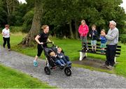 18 August 2018; parkrun participants are cheered on by Molly, age 9, Jack, age 6, and Tommy age 4, and their Grandfather Sean Stakelum, from Longford, at the Longford parkrun where Vhi hosted a special event to celebrate their partnership with parkrun Ireland. Vhi ambassador and Olympian David Gillick was on hand to lead the warm up for parkrun participants before completing the 5km free event. Parkrunners enjoyed refreshments post event at the Vhi Relaxation Area where a physiotherapist took participants through a post event stretching routine.   parkrun in partnership with Vhi support local communities in organising free, weekly, timed 5k runs every Saturday at 9.30am.To register for a parkrun near you visit www.parkrun.ie. Photo by Seb Daly/Sportsfile