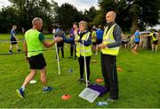 18 August 2018; Volunteers hand out tokens to finishers at the Longford parkrun where Vhi hosted a special event to celebrate their partnership with parkrun Ireland. Vhi ambassador and Olympian David Gillick was on hand to lead the warm up for parkrun participants before completing the 5km free event. Parkrunners enjoyed refreshments post event at the Vhi Relaxation Area where a physiotherapist took participants through a post event stretching routine.   parkrun in partnership with Vhi support local communities in organising free, weekly, timed 5k runs every Saturday at 9.30am.To register for a parkrun near you visit www.parkrun.ie. Photo by Seb Daly/Sportsfile