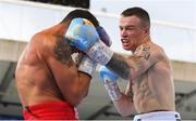 18 August 2018; Steven Donnelly, right, in action against Kevin McCauley during their super welterweight bout at Windsor Park in Belfast. Photo by Ramsey Cardy/Sportsfile