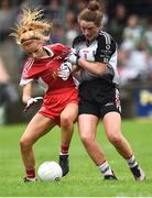 18 August 2018; Emma Brennan of Tyrone in action against Sinead Regan of Sligo during the 2018 TG4 All-Ireland Ladies Intermediate Football Championship semi-final match between Sligo and Tyrone at Fr. Tierney Park in Donegal. Photo by Oliver McVeigh/Sportsfile