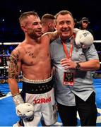 18 August 2018; Carl Frampton celebrates his victory against Luke Jackson with father Craig following their interim World Boxing Organisation World Featherweight Title bout at Windsor Park in Belfast. Photo by Ramsey Cardy/Sportsfile