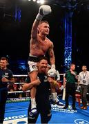 18 August 2018; Carl Frampton celebrates his victory against Luke Jackson with coach Nigel Travis following their interim World Boxing Organisation World Featherweight Title bout at Windsor Park in Belfast. Photo by Ramsey Cardy/Sportsfile