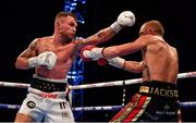 18 August 2018; Carl Frampton, left, in action against Luke Jackson during their interim World Boxing Organisation World Featherweight Title bout at Windsor Park in Belfast. Photo by Ramsey Cardy/Sportsfile