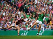 19 August 2018; Aaron Gillane of Limerick scores his side's first point despite a block from Adrian Tuohy of Galway during the GAA Hurling All-Ireland Senior Championship Final match between Galway and Limerick at Croke Park in Dublin. Photo by Eóin Noonan/Sportsfile