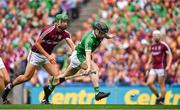 19 August 2018; Graeme Mulcahy of Limerick on his way to scoring his side's first goal despite the best efforts of Adrian Tuohy of Galway during the GAA Hurling All-Ireland Senior Championship Final match between Galway and Limerick at Croke Park in Dublin.  Photo by Brendan Moran/Sportsfile