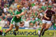 19 August 2018; Tom Morrissey of Limerick flicks the sliothar past Adrian Tuohy of Galway to score his side's second goal in the 54th minute of the GAA Hurling All-Ireland Senior Championship Final match between Galway and Limerick at Croke Park in Dublin.  Photo by Ray McManus/Sportsfile