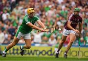 19 August 2018; Tom Morrissey of Limerick flicks the sliothar past Adrian Tuohy of Galway to score his side's second goal in the 54th minute of the GAA Hurling All-Ireland Senior Championship Final match between Galway and Limerick at Croke Park in Dublin.  Photo by Ray McManus/Sportsfile