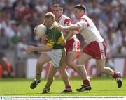 24 August 2003; Liam Hassett of Kerry in action against Conor Gormley and Ryan McMenamin of Tyrone during the Bank of Ireland All-Ireland Senior Football Championship Semi-Final match between Tyrone and Kerry at Croke Park in Dublin. Photo by Damien Eagers/Sportsfile