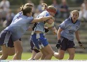 30 August 2003; Aislng Tierney, Monaghan, is tackled by Dublin's Marie Kavanagh. TG4 Ladies All-Ireland Senior Football Championship Quarter-Final, Dublin v Monaghan, Pearse Park, Co. Longford. Picture credit; Damien Eagers / SPORTSFILE