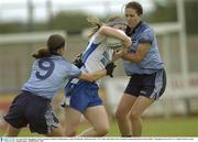 30 August 2003; Monaghan's Jenny Grennan,is tackled by Dublin players Angie McNally,left, and Bernie Finlay. TG4 Ladies All-Ireland Senior Football Championship Quarter-Final, Dublin v Monaghan, Pearse Park, Co. Longford. Picture credit; Damien Eagers / SPORTSFILE