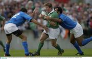 30 August 2003; Brian O'Driscoll, Ireland, in action against Italy's Matteo Barbini,12, and Cristian Stoica during the Permanent TSB test between Ireland and Italy at Thomond Park, Limerick. Picture credit; Matt Browne / SPORTSFILE