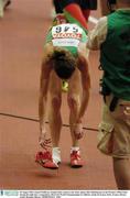 30 August 2003; Sonia O'Sullivan, Ireland (546), removes one of her spikes after finishing last in the Women's 500m Final during the eight day's competition at the 9th IAAF World Championships in Athletics at the Stade de France, Paris, France. Picture credit; Brendan Moran / SPORTSFILE