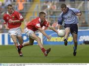 31 August 2003; John Coughlan, Dublin, in action against Cork's Michael Shields in the All-Ireland Minor Football Championship Semi-Final between Dublin and Cork at Croke Park, Dublin. Picture credit; Damien Eagers / SPORTSFILE
