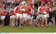 31 August 2003; The Armagh team, led by captain Kieran McGeeney, run onto the pitch before the Bank of Ireland All-Ireland Senior Football Championship Semi-Final between Armagh and Donegal at Croke Park in Dublin. Photo by Ray McManus/Sportsfile