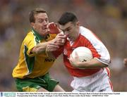 31 August 2003; Oisin McConville, Armagh, in action against Raymond Sweeney, Donegal during the Bank of Ireland All-Ireland Senior Football Championship Semi-Final between Armagh and Donegal at Croke Park, Dublin. Photo by Ray McManus/Sportsfile