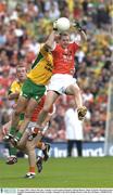 29 August 2003; Andrew McCann, Armagh, in action against Donegal's Michael Hegarty during the Bank of Ireland All-Ireland Senior Football Championship Semi-Final between Armagh and Donegal at Croke Park in Dublin. Photo by Ray McManus/Sportsfile