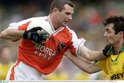 29 August 2003; Steven McDonnell, Armagh, in action against Donegal's Niall McCready during the Bank of Ireland All-Ireland Senior Football Championship Semi-Final between Armagh and Donegal at Croke Park in Dublin. Photo by Ray McManus/Sportsfile