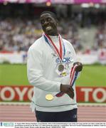 31 August 2003; Dwain Chambers, Great Britain, with a Gold medal belonging to one of the USA team and his own Silver medal after the presentation ceremony for the Men's 4 X 100m during the ninth day's competition at the 9th IAAF World Championships in Athletics at the Stade de France, Paris, France. Picture credit; Brendan Moran / SPORTSFILE