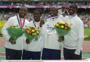 31 August 2003; The Great Britain team who won Silver in the Men's 4 X 100m, from left, Darren Campbell, Christian Malcolm, Marlon Devonish and Dwain Chambers after the presentation ceremony during the ninth day's competition at the 9th IAAF World Championships in Athletics at the Stade de France, Paris, France. Picture credit; Brendan Moran / SPORTSFILE