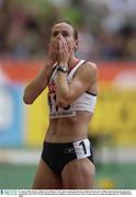 31 August 2003; Hayley Tullett, Great Britain, reacts after winning the Bronze medal in the Women's 1500m FInal during the ninth day's competition at the 9th IAAF World Championships in Athletics at the Stade de France, Paris, France. Picture credit; Brendan Moran / SPORTSFILE