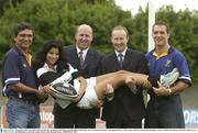 3 September 2003; Garry Ella, Leinster Coach, left, and flanker Keith Gleeson, get help lifting model Tania Alvzarez from Keith Granger, Tournament Director, Celtic League, 2nd from left, and Rory Sheridan, Guinness Ireland at the announcement that Guinness are to the Official Beer to the Celtic League. Picture credit; Brendan Moran / SPORTSFILE