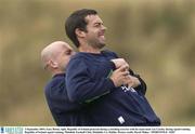 3 September 2003; Gary Breen, right, pictured doing a stretching exercise with his team-mate Lee Carsley during a Republic of Ireland training session at Malahide Football Club in Malahide, Dublin. Photo by David Maher/Sportsfile