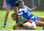 30 August 2003; Michelle McGing of Mayo in action against Edel Reilly of Waterford during the TG4 Ladies All-Ireland Senior Football Championship Quarter-Final between Mayo and Waterford at Cusack Park, Ennis, Co Clare. Picture credit;  Kieran Clancy / SPORTSFILE