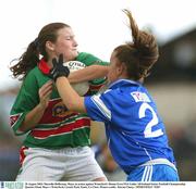 30 August 2003; Marcella Heffernan of Mayo in action against Waterford's Donna Frost during the TG4 Ladies All-Ireland Senior Football Championship Quarter-Final between Mayo and Waterford at Cusack Park, Ennis, Co Clare. Picture credit;  Kieran Clancy / SPORTSFILE