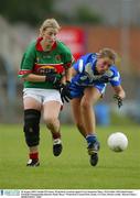 30 August 2003; Natalie O'Connor of Waterford in action against Cora Staunton of Mayo during the TG4 Ladies All-Ireland Senior Football Championship Quarter-Final between Mayo and Waterford at Cusack Park, Ennis, Co Clare. Picture credit;  Kieran Clancy / SPORTSFILE
