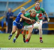 30 August 2003; Nuala O'Shea of Mayo holds off Aine Wall of Waterford during the TG4 Ladies All-Ireland Senior Football Championship Quarter-Final between Mayo and Waterford at Cusack Park, Ennis, Co Clare. Picture credit;  Kieran Clancy / SPORTSFILE