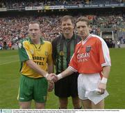29 August 2003; Referee Michael Monahan with captains Adrian Sweeney, left, Donegal and Kieran McGeeney, Armagh during the Bank of Ireland All-Ireland Senior Football Championship Semi-Final between Armagh and Donegal at Croke Park in Dublin. Photo by Ray McManus/Sportsfile