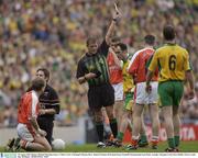 29 August 2003; Referee Michael Monahan issues a 'Yellow Card' to Donegal's Damien Diver during the Bank of Ireland All-Ireland Senior Football Championship Semi-Final between Armagh and Donegal at Croke Park in Dublin. Photo by Ray McManus/Sportsfile
