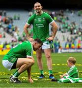 19 August 2018; Limerick's Tom Condon, 18, with his son Nicky, and Diarmaid Byrnes of Limerick following the GAA Hurling All-Ireland Senior Championship Final match between Galway and Limerick at Croke Park in Dublin.  Photo by Ramsey Cardy/Sportsfile
