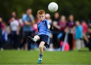 19 August 2018; Ryan Holland of Oranmore, Co. Galway competing in the Gaelic Football U10 Final event during day two of the Aldi Community Games August Festival at the University of Limerick in Limerick. Photo by Harry Murphy/Sportsfile