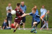 19 August 2018; Josh Marrinan of Ballynacally-Lissycasey, Co. Clare, in action against Ryan Holland of Oranmore, Co. Galway, during the Boys U10 & O7 Gaelic Football event during day two of the Aldi Community Games August Festival at the University of Limerick in Limerick. Photo by Sam Barnes/Sportsfile