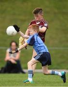 19 August 2018; Josh Marrinan of Ballynacally-Lissycasey, Co. Clare, in action against Ryan Holland of Oranmore, Co. Galway, during the Boys U10 & O7 Gaelic Football event during day two of the Aldi Community Games August Festival at the University of Limerick in Limerick. Photo by Sam Barnes/Sportsfile