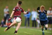 19 August 2018; Josh Marrinan of Ballynacally-Lissycasey, Co. Clare, in action against Ryan Holland of Oranmore, Co. Galway, during the Boys U10 & O7 Gaelic Football event during day two of the Aldi Community Games August Festival at the University of Limerick in Limerick. Photo by Sam Barnes/Sportsfile